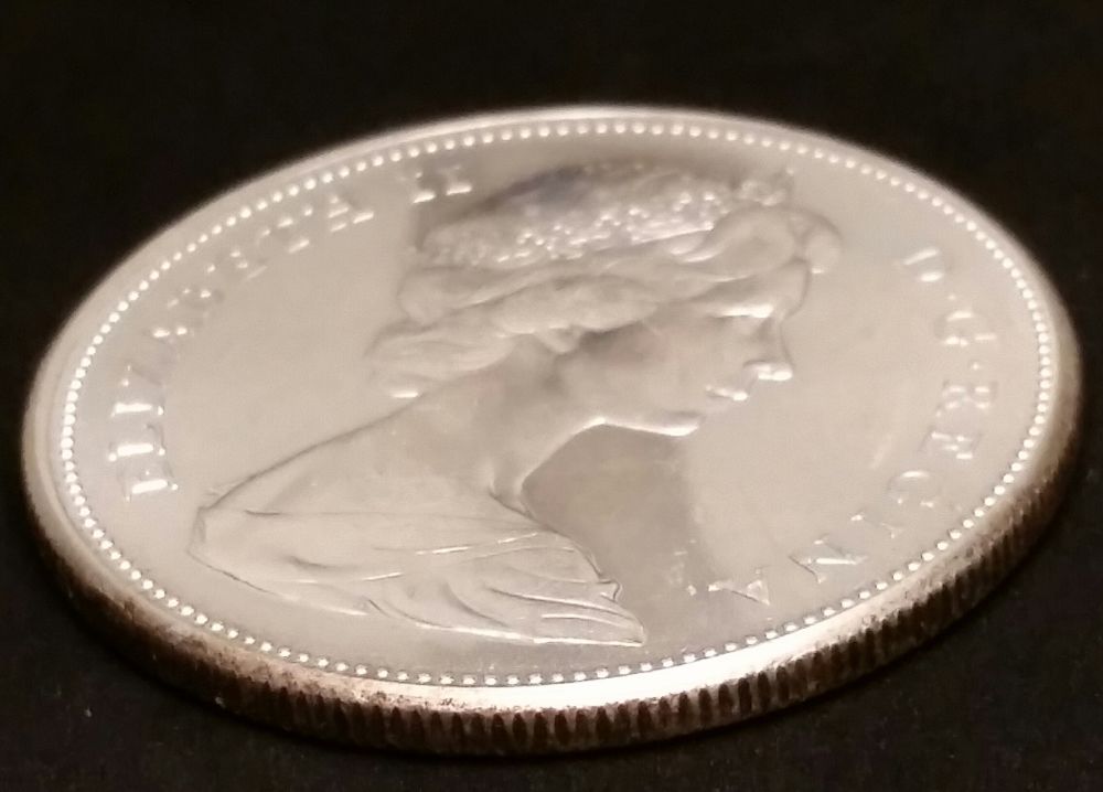 1967-Canadian-Dollar-Off-Center-Strike-Or-Soft-Struck-Edge?